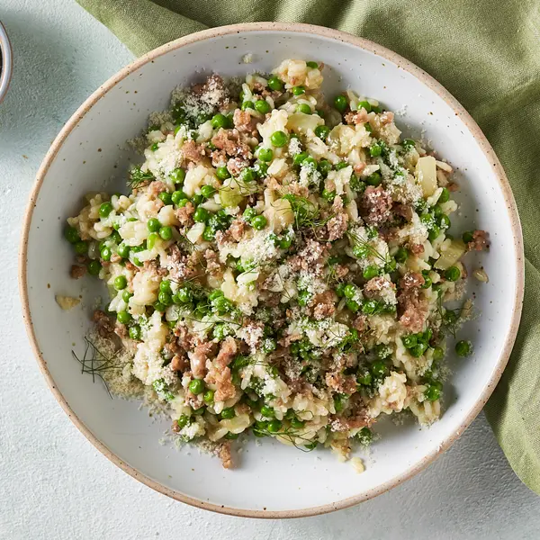 Risotto au fenouil, saucisses et petits pois